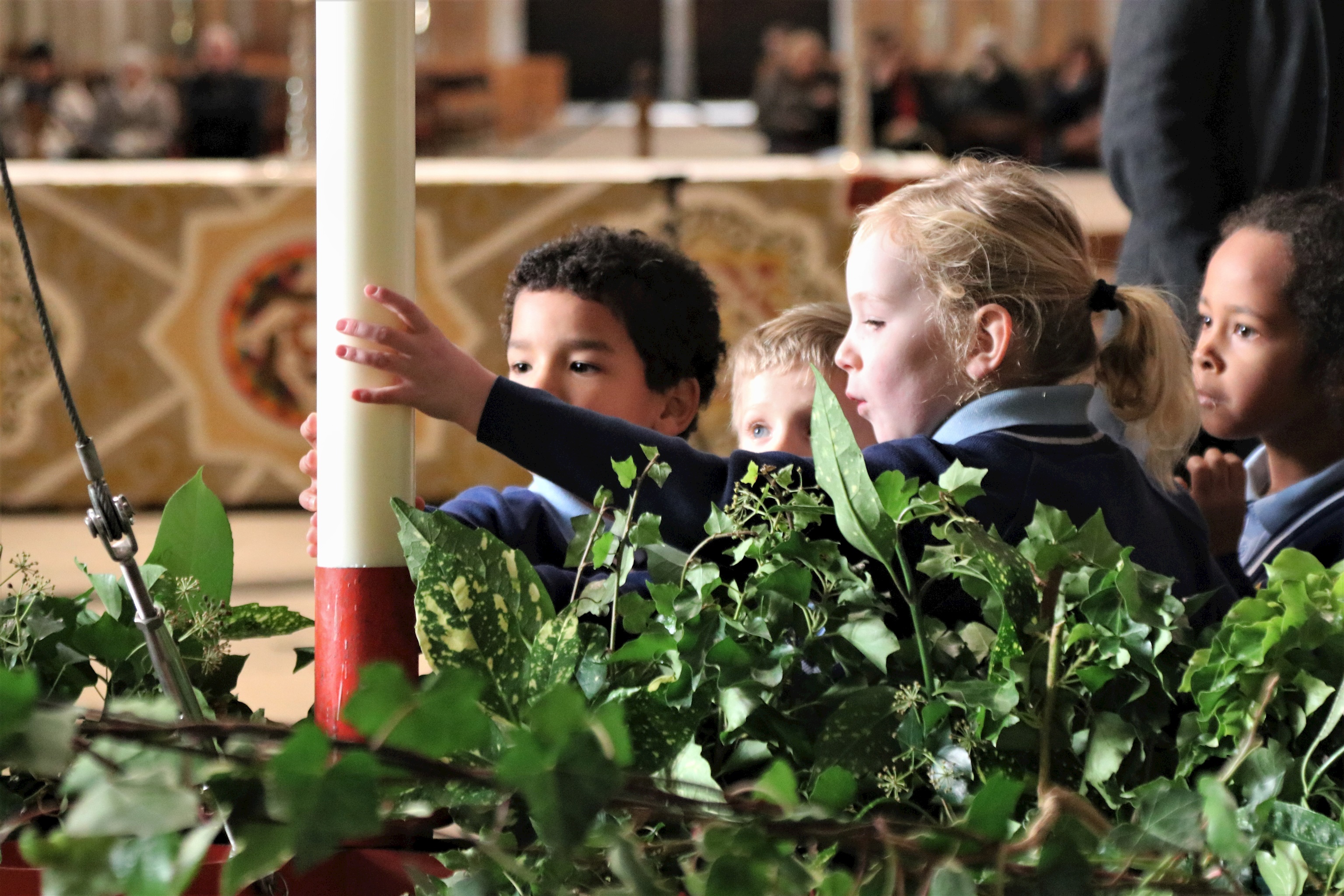 St Peter's 2-8 children help to raise the Advent Wreath at York Minster